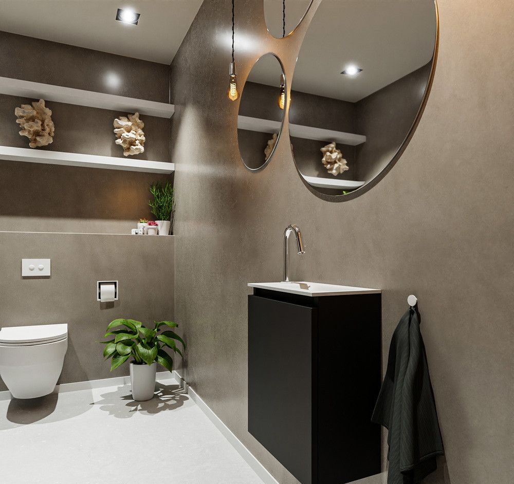 Wc renovatie met sfeervolle microcement wanden en ronde spiegels Wc renovatie met sfeervolle microcement wanden en ronde spiegels